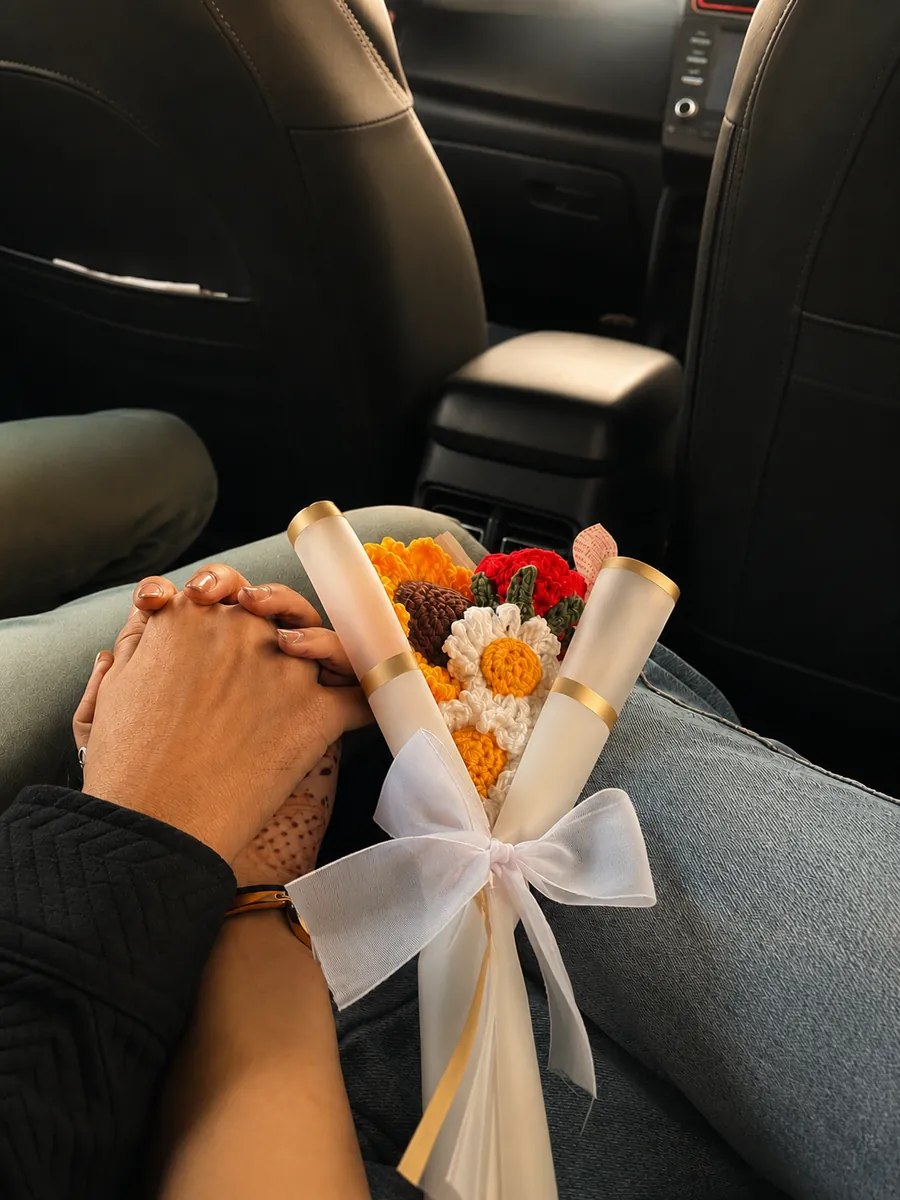 Holding hands with a bouquet on the day we first met